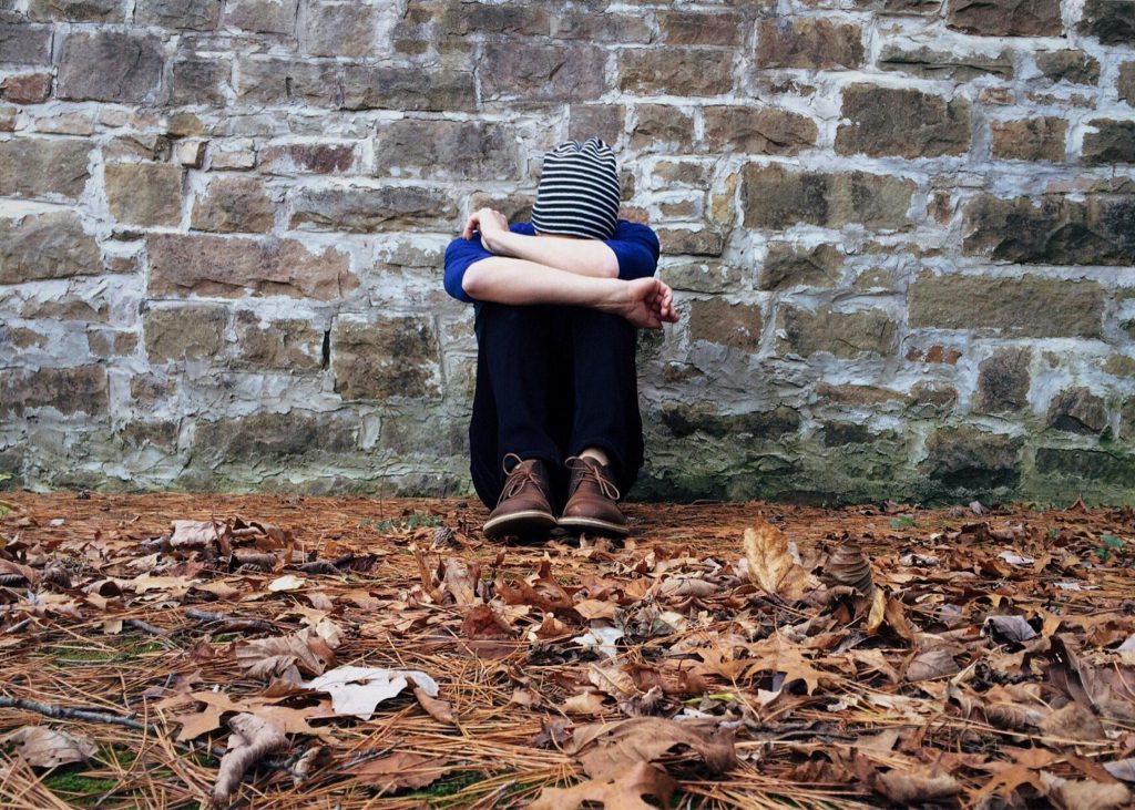 woman sitting on the ground