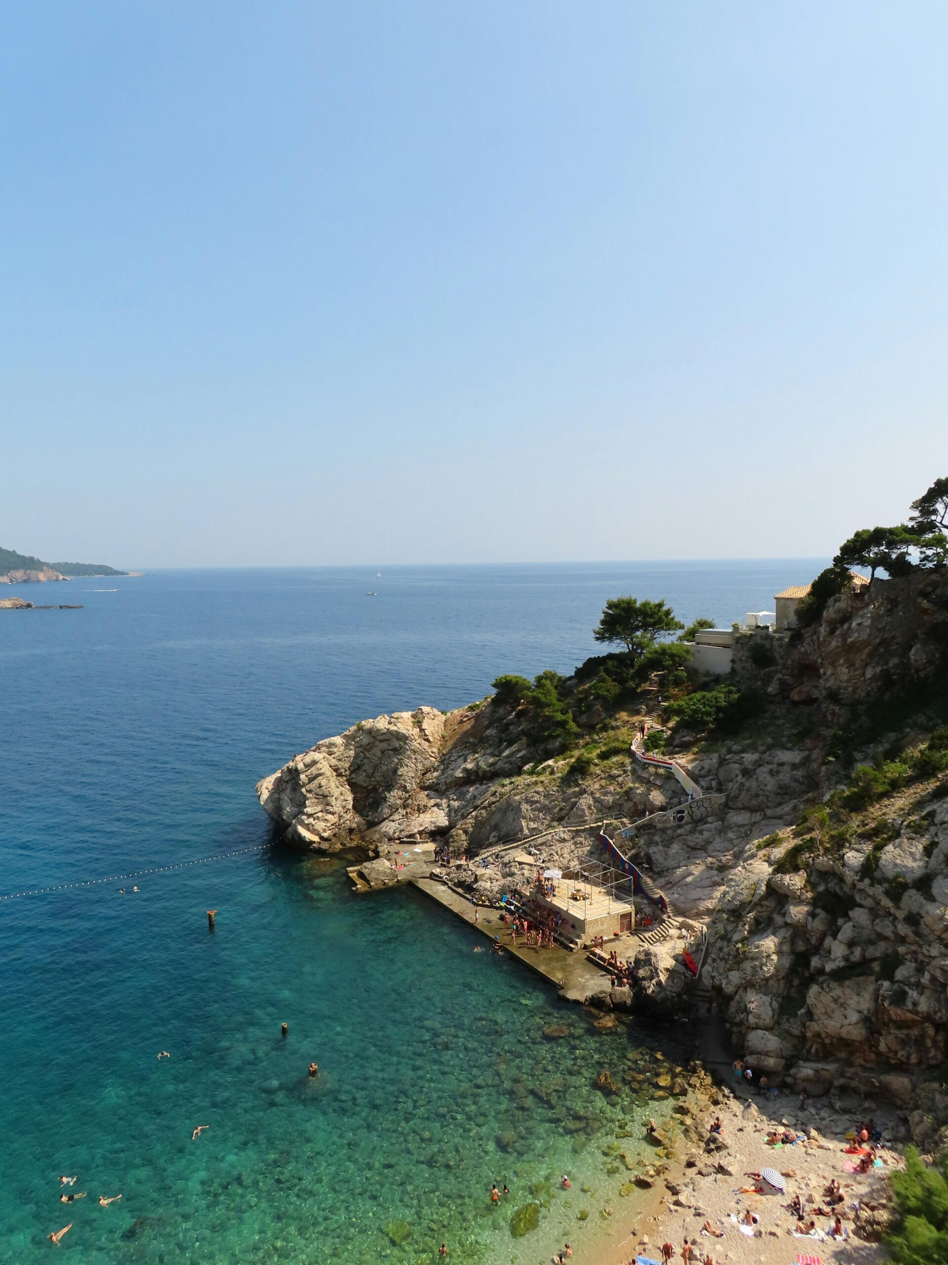 Scenic coastal cliff and clear blue ocean near San Juan Capistrano, representing calm and healing at Capo Beach Recovery in Orange County, CA.
